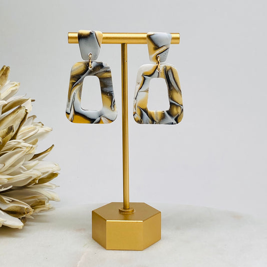Terri Black, White, and Gold